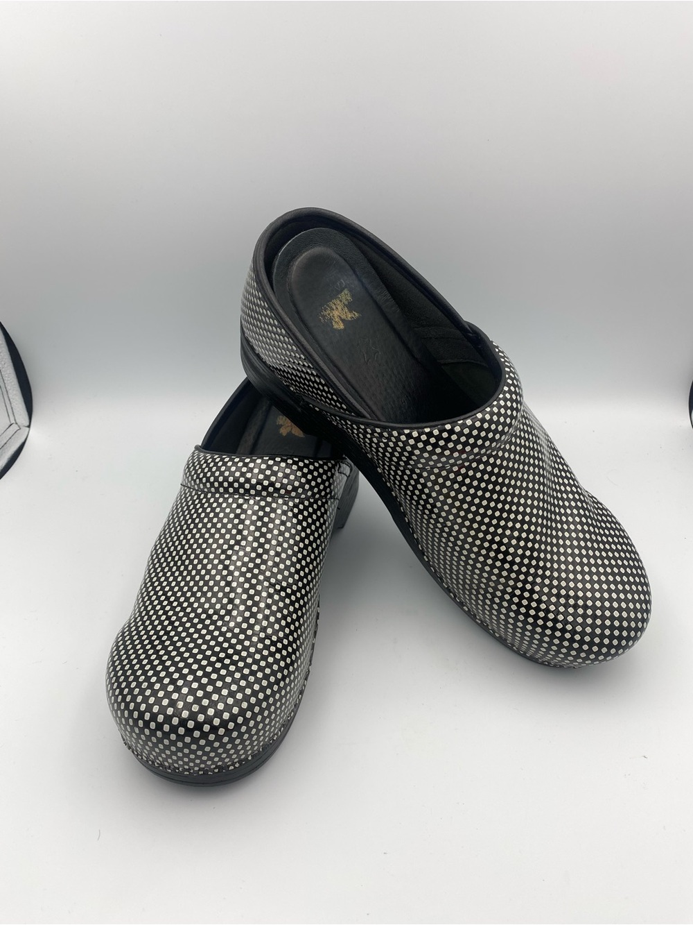 Dansko Black Slip-On Clogs with White Dot Pattern